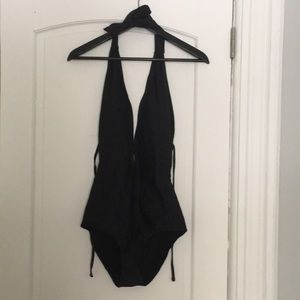One piece open back black bathing suit